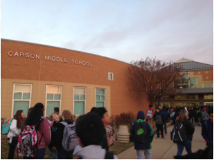 Students wait outside the school waiting for the doors to open. Nov. 30 