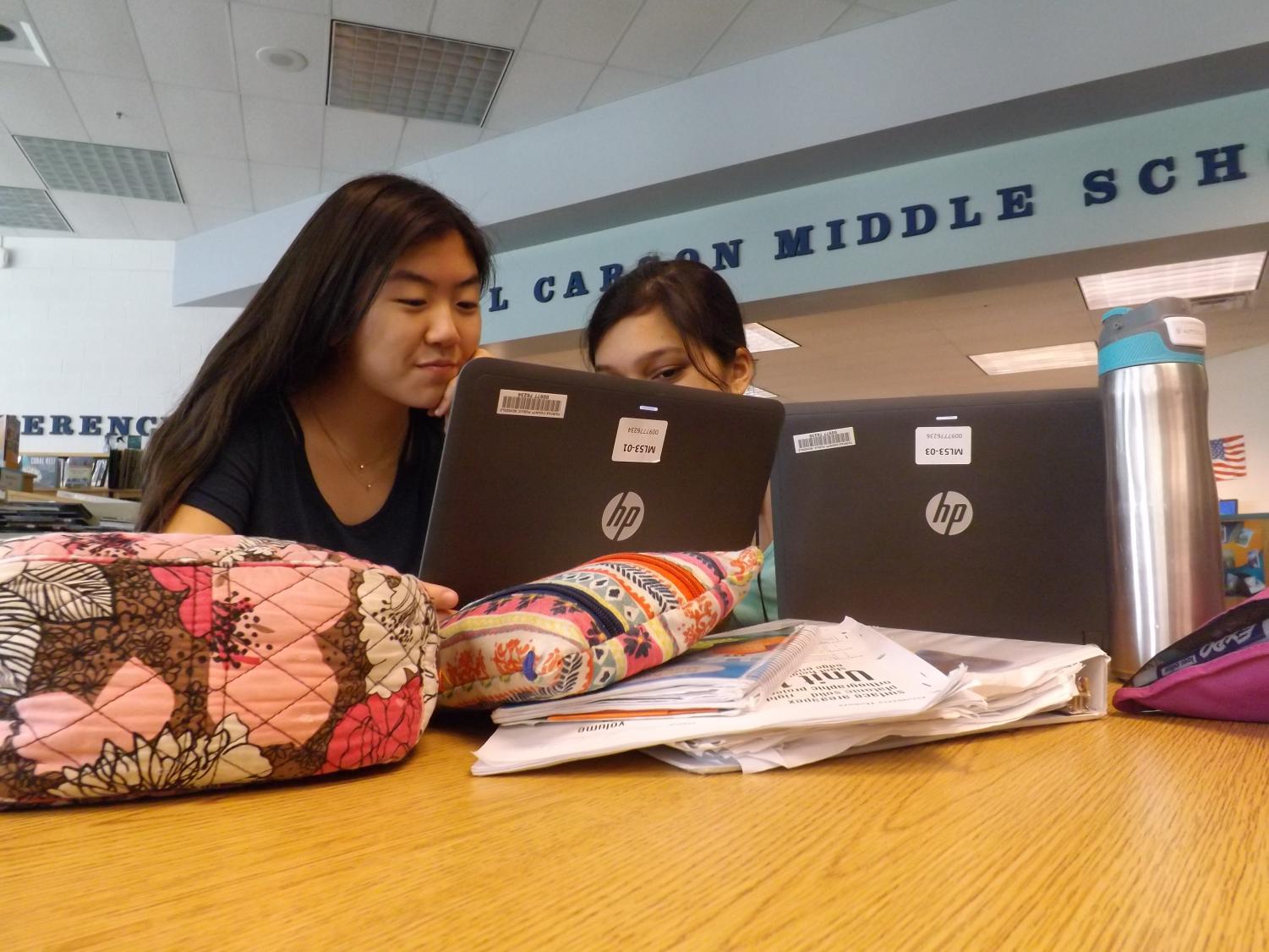 Eighth-graders Arielle Kim and Sreya Devarakonda hard at work on their Capstone project.