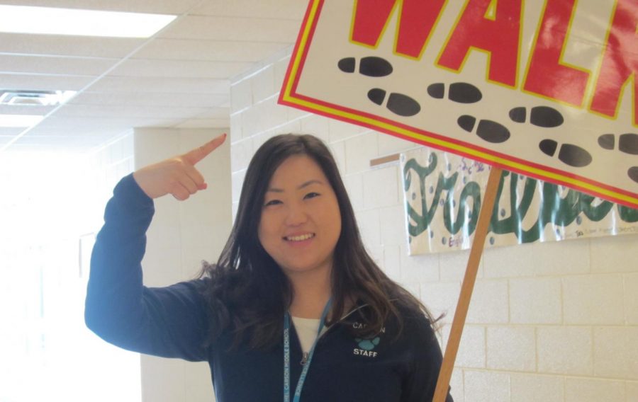 Ms.Oh holding the walk sign