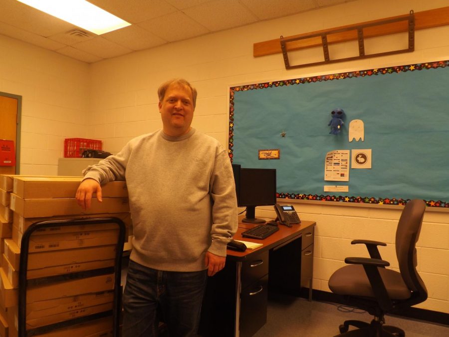 Mr.Hale with a new stack of computers for tech ed.