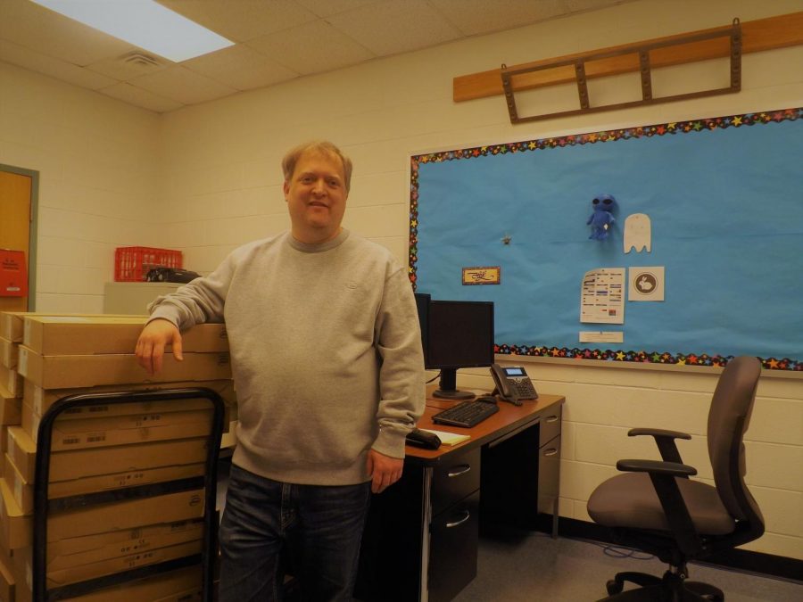 Mr.Hale with a new stack of computers for tech ed.