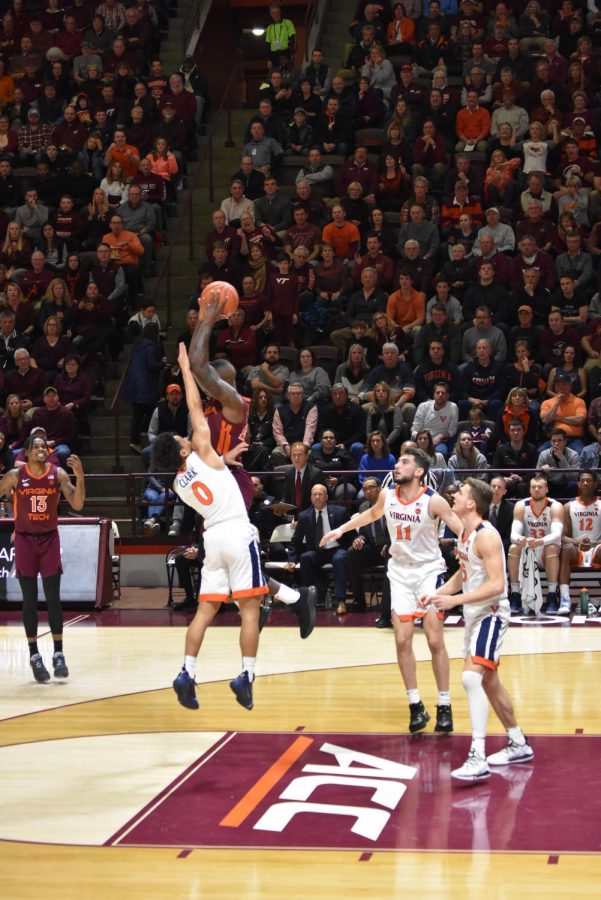 Kihei Clark jumps up to get a rebound