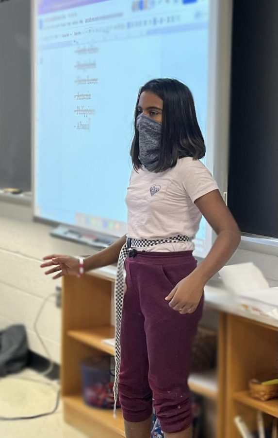 Dhaya Kumaresan, an eighth grader on the Voyagers, presents herself as the Philippines during a “Development in LDCs mock” in Model UN. 

