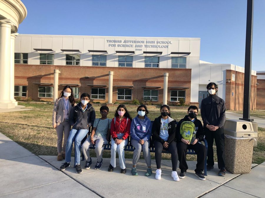 Ms. Lee (far left) and the seven RCMS students chosen for the TJIMO gather in front of the TJHSST building on the day of the contest.
