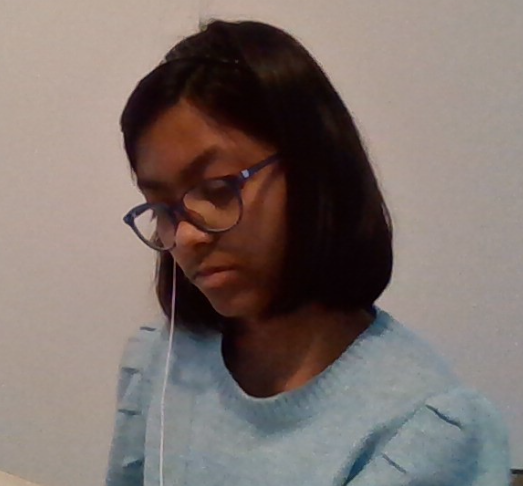 Ananya Sah, seventh- grader in the Majestics team, listens to BTSs Stay Alive