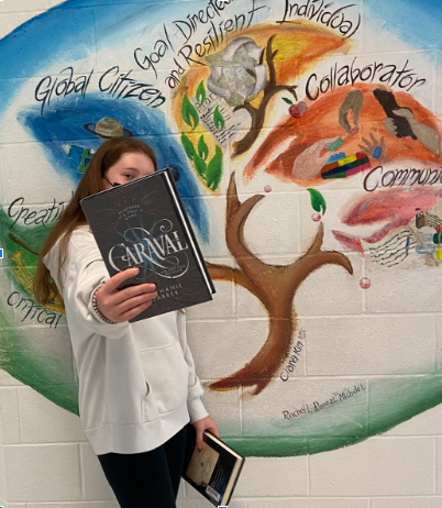 Maisie McArter eighth-grader on the Dolphins Team, presenting popular ‘BookTok’ Books.