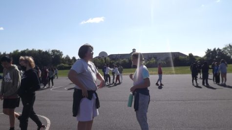  8-graders Wyatt Hawes (left) and Natalie Taranova (right) enjoy outdoor activities during their PE period.
