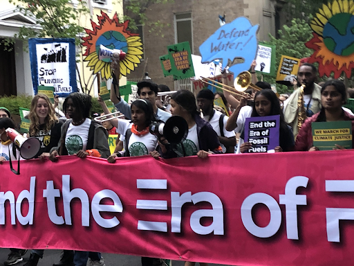 Climate action protest with Ariya Lee (holding megaphone), and Nethra Purushothaman (left of Ariya). Courtesy photo.