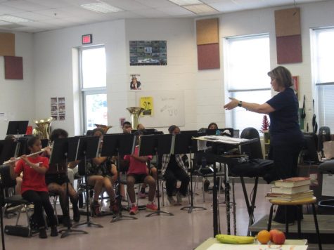 Ms. Hitz, the RCMS band teacher conducts the Concert Band.