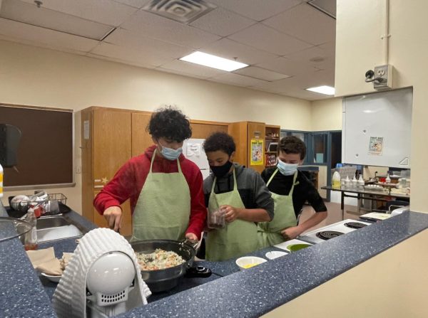 Students at Stone Middle School cook in a cooking lab.