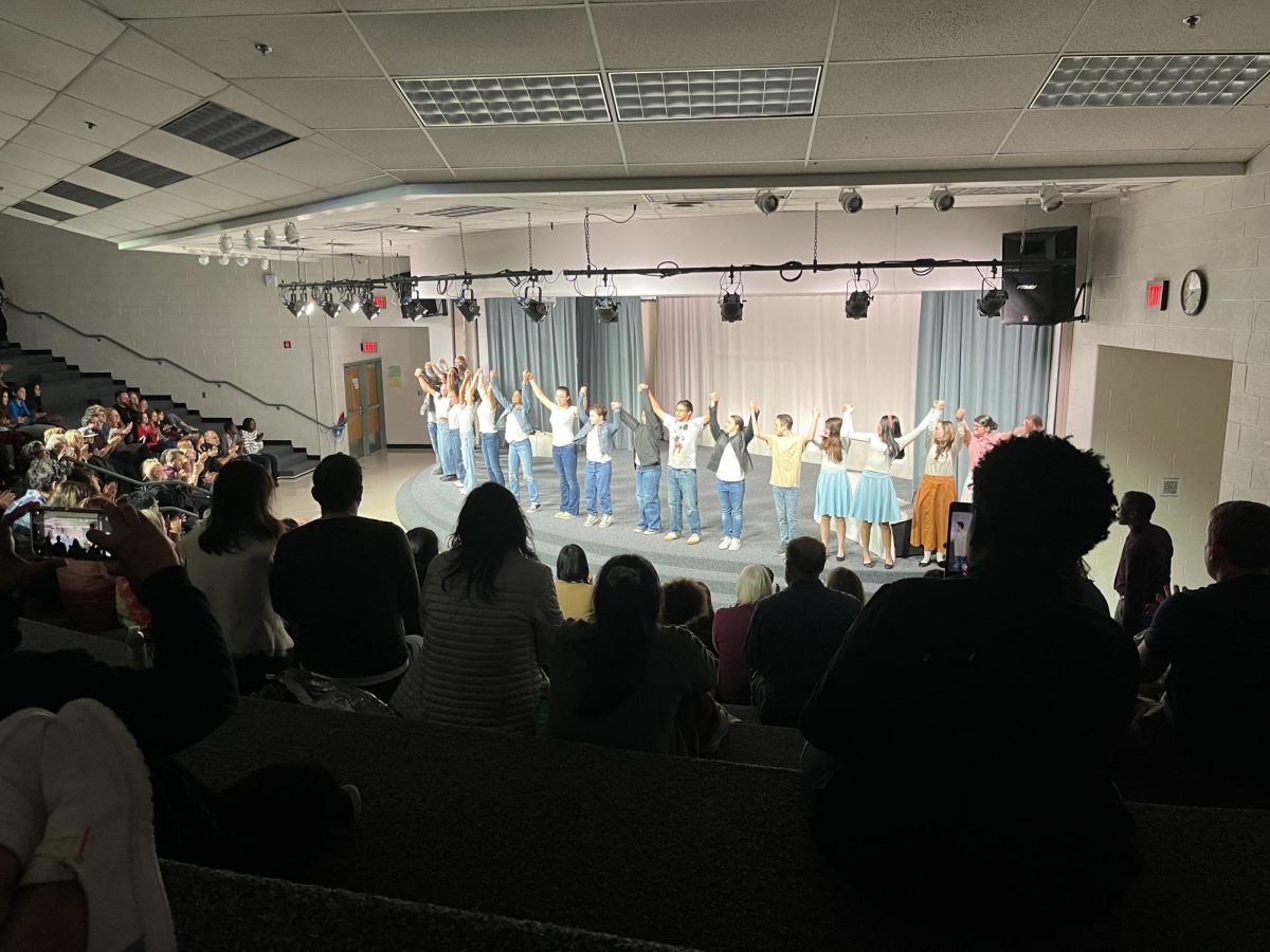 RCMS student actors happily take a bow after a great performance.