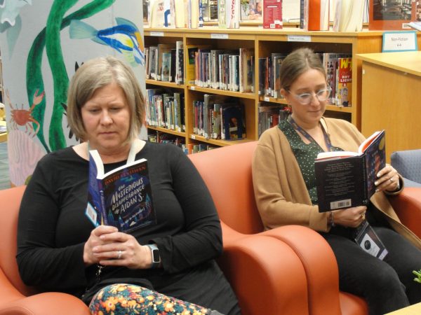 Ms. Ellen Bickford (left) and Ms. Elizabeth Donovan (right), reading VRC books together.

