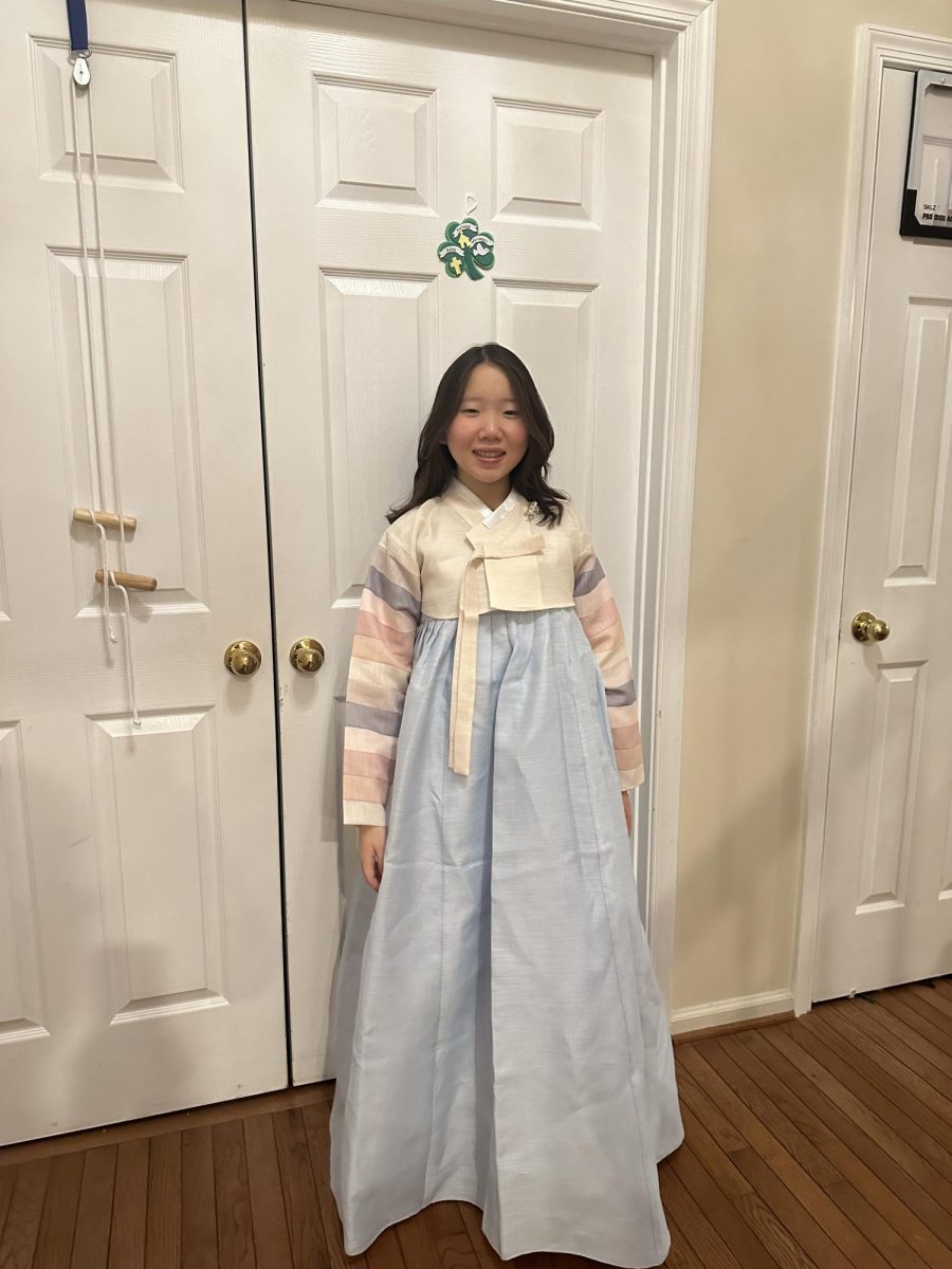 Anne Park, 12, Majestics team, gets ready at her house for the Lunar New Year festival wearing traditional Korean clothing on Jan. 25.