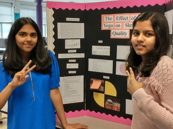 Ananya Sudharshan, 12, Trailblazers and Shwetal Sudhakar, 12, Champions pose in front of Ananya’s science fair trifold. ‘I really wanted to do a science fair since I’ve never done one before and it seemed like a really good opportunity,’ says Ananya.