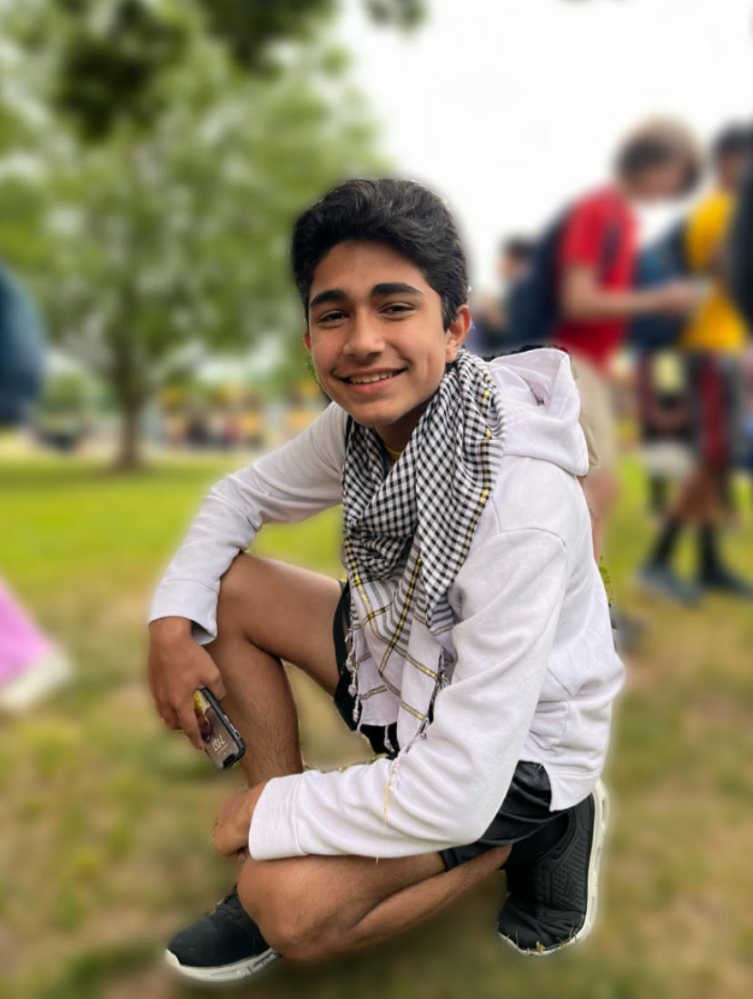 Seare Khairzada wearing a Kufiyah-styled scarf to show his support for Palestine at school. 