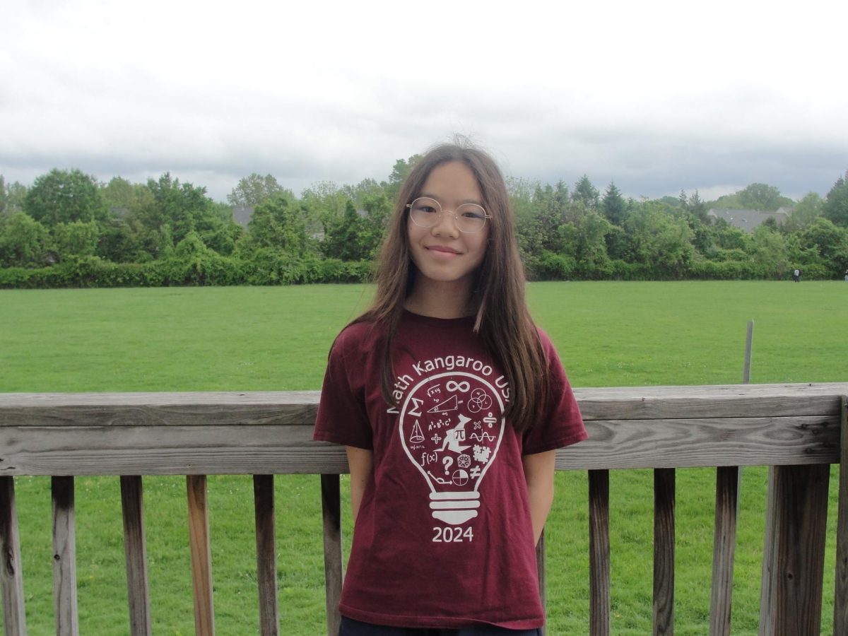 Anya Zhang, seventh-grader, on the Trailblazers team enjoys talking about Studio Ghiblib art.