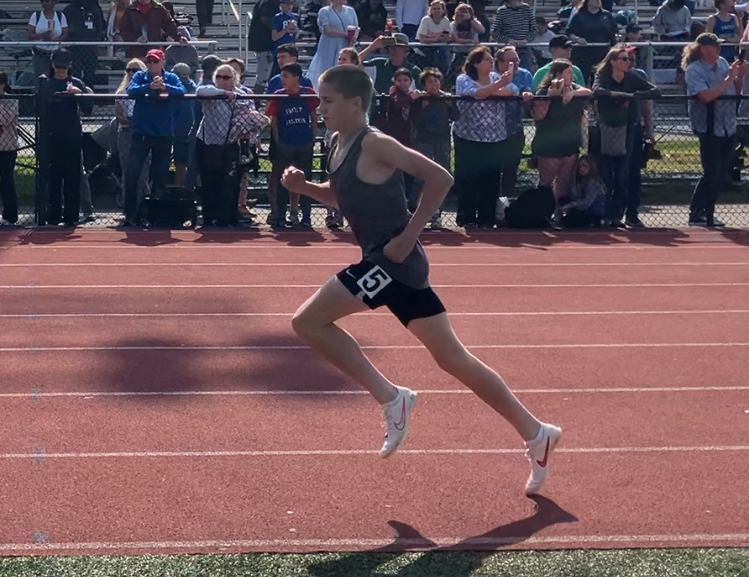Roman Nall participates in the men’s 1600-meter run at the Championship Meet.