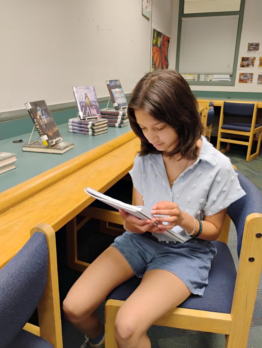 Sanvi Patwardhan, a seventh-grader on the Champions team, preparing for the Trivia Tournament